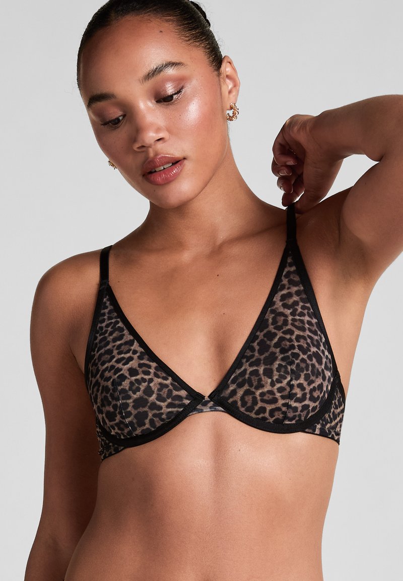 Leopard print bralette with black trim, featuring a soft, sheer fabric and triangle cups, adjustable straps, and a simple clasp at the back.