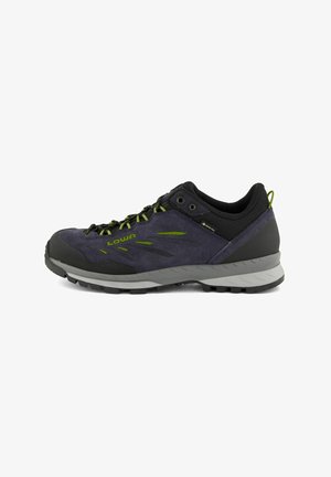 Lowa hiking shoe featuring a dark blue and black design, synthetic materials, lace-up closure, and a rugged rubber sole for traction.