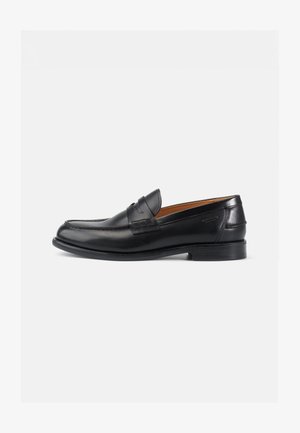 Black leather loafers with a rounded toe, embossed detailing on the upper, and a smooth texture; features a low heel and flexible sole.