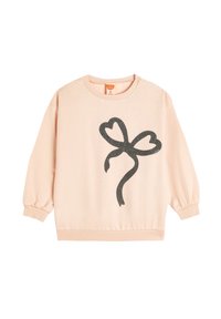 Felpa rosa chiaro, texture morbida, vestibilità rilassata, con una grafica a forma di cuore con fiocco nero glitterato sul davanti, polsini a costine e orlo.