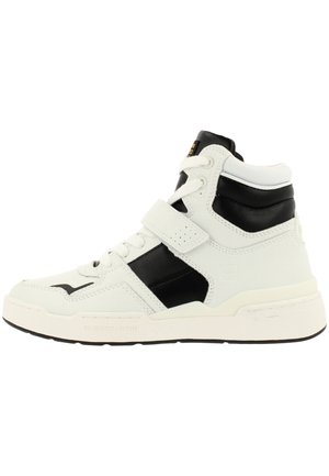 White high-top sneaker with black accents, leather and synthetic materials, lace-up with a Velcro strap, textured detailing, and rubber sole.
