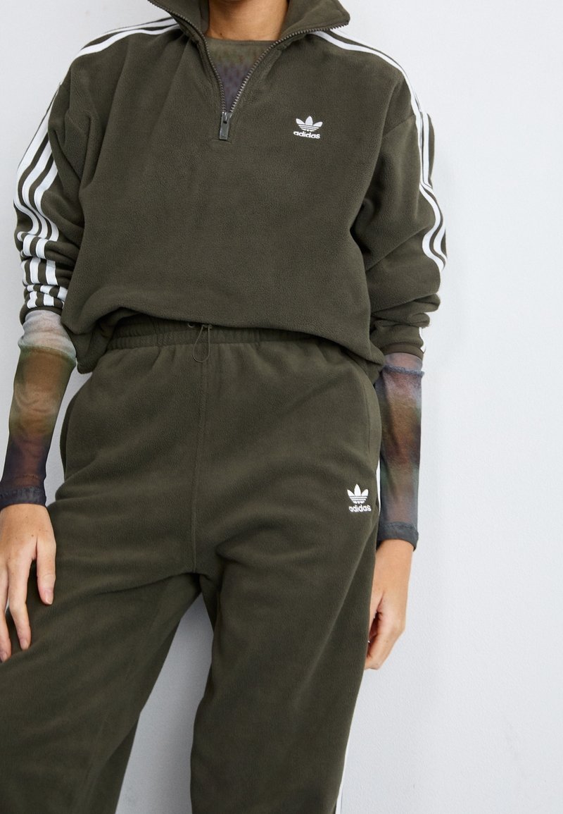 adidas Originals Tracksuit bottoms olive (Pre-owned)