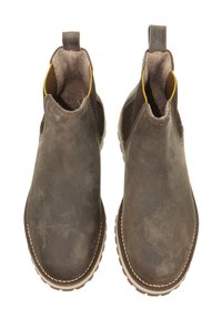 Braune Leder-Stiefeletten mit elastischen seitlichen Einsätzen, texturiertem Finish und Schlaufe. Stichdetails entlang der Sohle. Robuste Laufsohle.