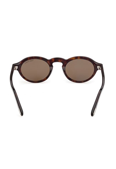 Runde Sonnenbrille mit braunen Gläsern, Schildpatt-Fassung und dünnen, gebogenen Bügeln, von vorne vor weißem Hintergrund gezeigt.