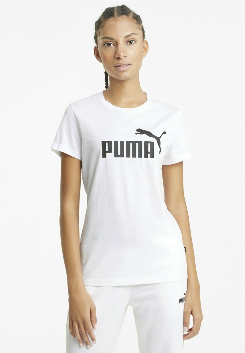 Valkoinen puuvillapaita, jossa on rohkea musta "PUMA" -logo ja siluetti rinnassa. Lyhyet hihat ja pyöreä pääntie.