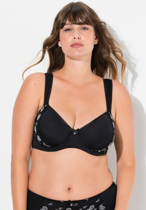Reggiseno nero con coppe sagomate, stampa paisley decorativa sui lati, spalline regolabili e un piccolo dettaglio a fiocco al centro davanti.