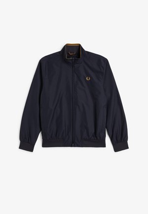 Giacca leggera blu navy con zip frontale, polsini e orlo elastici, collo alto e piccolo logo dellauri ricamato in oro sul petto.