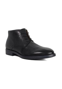 Black leather ankle boots with a textured finish, smooth toe, and round lace-up design. Features a flat sole and minimalistic style.