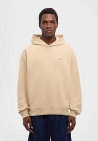 Holzweiler RELAXED HOODIE UNISEX Hoodie sand Zalando