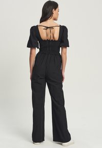 CALLI CORA - Mono - black