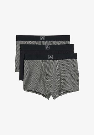 Drei Paar Herren-Boxershorts mit schwarzen Bund, zwei mit einem schwarz-weißen Zickzackmuster und eine in der Mitte einfarbig schwarz.