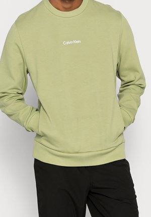 Sudadera verde claro de tejido de mezcla de algodón, con cuello redondo, puños y cintura acanalados, y el logotipo "Calvin Klein" en blanco.