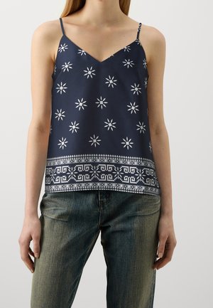 Top in blu navy con motivo a stelle bianche, scollatura a V e spalline sottili; presenta un bordo decorato all'orlo.