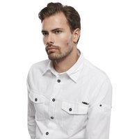 Camicia bianca button-up in cotone, con bottoni neri, due tasche sul petto e un piccolo dettaglio sulla manica. Tessuto liscio.