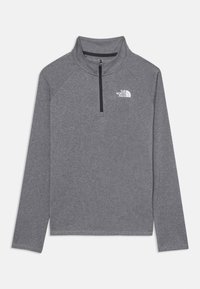 Γκρίζο φλις πουλόβερ με ψηλό γιακά και φερμουάρ μέχρι το ένα τέταρτο. Διαθέτει μακριά μανίκια και λογότυπο στο αριστερό στήθος.