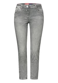 Jean rayé noir et blanc avec une coupe ajustée, cinq poches et une fermeture à boutons. Texture lisse avec un léger éclat.