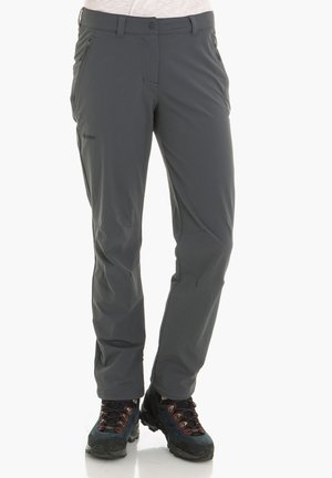 Graue Outdoor-Hosen aus glattem, leichtem Stoff, mit Seitentaschen und Knopfverschluss. Getragen mit dunklen Wanderschuhen.
