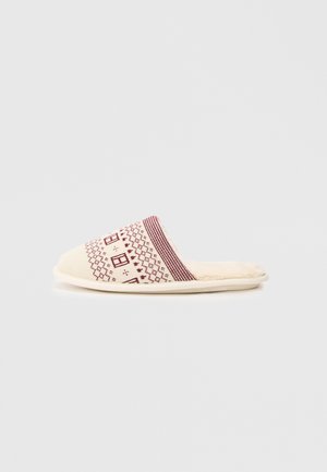 Cream slipper with maroon geometric pattern and house motifs on upper. Soft interior lining and rounded toe design. Rubber sole.