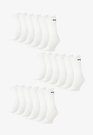 Weiße Baumwollsocken mit gerippter Struktur, versehen mit einem schwarzen Logo am Knöchel. Set aus 12 Paaren, angeordnet in zwei Reihen.