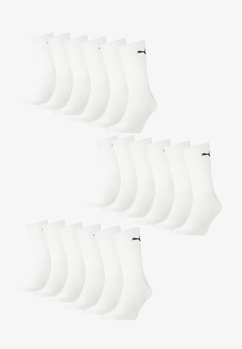 Weiße Baumwollsocken mit gerippter Struktur, versehen mit einem schwarzen Logo am Knöchel. Set aus 12 Paaren, angeordnet in zwei Reihen.