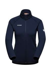 Giacca in pile blu navy con zip frontale, colletto alto e logo MAMMUT. Presenta polsini elasticizzati e tasche laterali. Texture morbida.