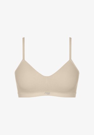 Soutien-gorge sans fil beige avec un design en V, des bretelles réglables et une texture de tissu lisse. Présente un logo subtil à la base.