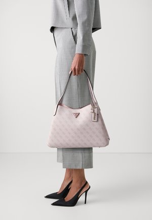 Light pink handbag with a textured pattern and shoulder strap, featuring a triangular logo and an attached keychain.