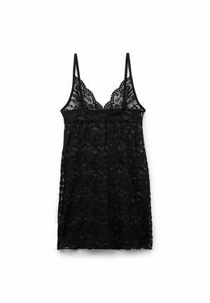 Camisole en dentelle noire avec de fines bretelles réglables, bordure en dentelle festonnée au niveau du décolleté, motif floral transparent, design ample.