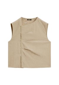 Top sans manches beige avec un col asymétrique, doté de boutons décoratifs et d'un design plissé à l'avant. Fabriqué en tissu texturé.