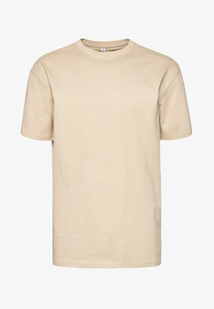 Beez värvi puuvillane T-särk ümmarguse kaelusega ja lühikeste käistega. Omab sirget lõiget ja sujuvat tekstuuri, tagaküljel on silt.