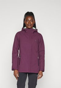 Veste imperméable violette avec capuche, deux poches zippées, cordons de serrage ajustables et doublure contrastante vert clair. Tissu texturé.