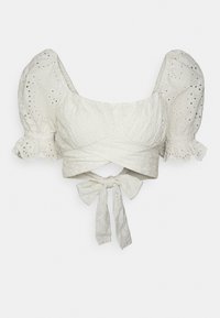 Top branco cropped com mangas bufantes, apresentando um tecido texturizado, bordado em ilhós e um fecho nas costas com laço. Design estruturado e ajustado.