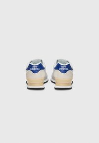 Grey and white sneakers with blue accents, suede and mesh materials, rounded shape, and a beige rubber sole. "New Balance" logo on heel.