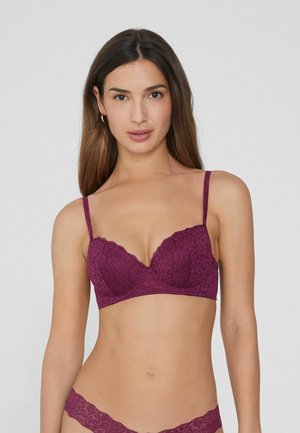 Mauve lace bra with scalloped edges, underwire support, and adjustable straps. Textured floral pattern across cups and band.