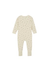 Ljust beige jumpsuit med långa ärmar och ankle cuffs, med ett spritt blommönster i mjuka rosa och gröna nyanser.