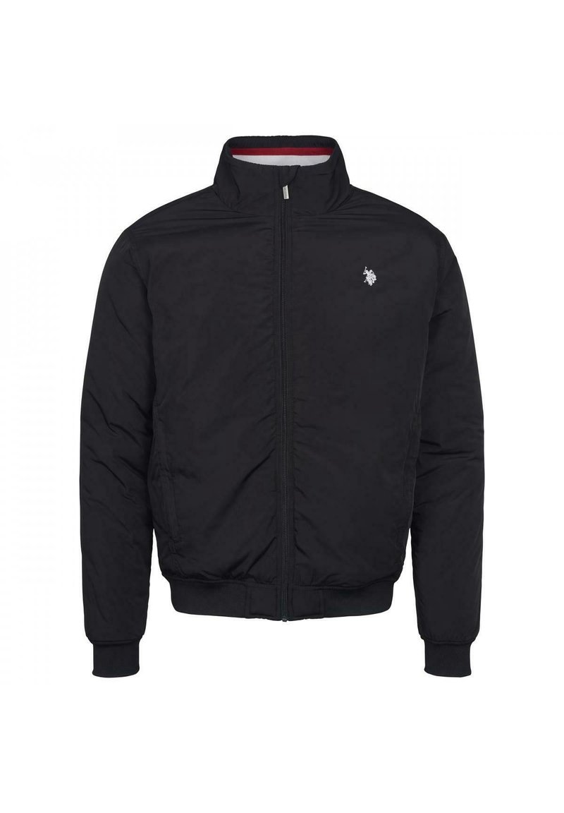 Svart bomberjacka med dragkedja framtill, ribbade muddarna och nederkant. Har en liten broderad logotyp på vänster bröst. Slät tygtextur.