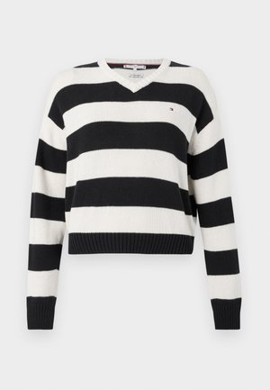 Čierno-biely pruhovaný pletený sveter s výstrihom do V, dlhými rukávmi a rebrovaným lemom. Na hrudi je malá logo.