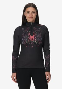 Top nero a maniche lunghe con colletto alto, caratterizzato da un ragno rosso e motivi floreali in colori vivaci. Realizzato in tessuto elasticizzato.