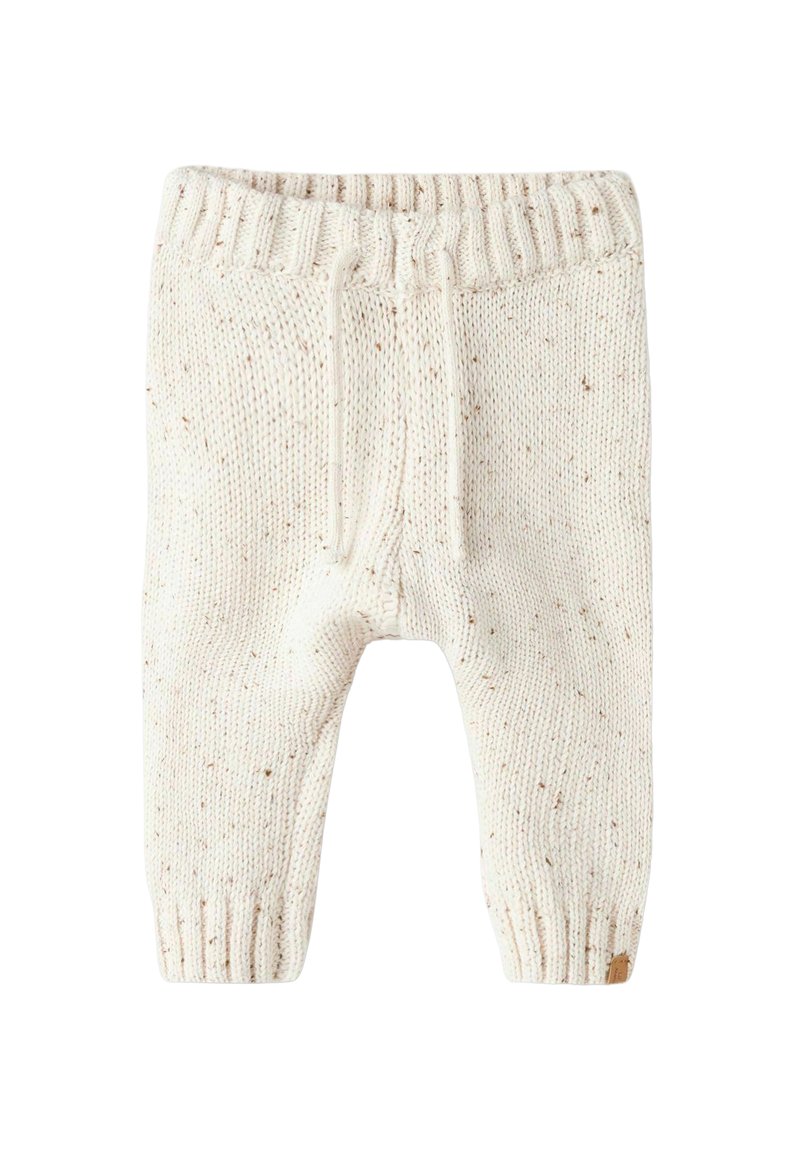 Pantalons en tricot crème avec des détails parsemés subtils, taille élastique, cordon de serrage et poignets côtelés. Texture douce et forme fuselée.