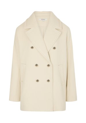 Double-breasted cream coat made of soft fabric, featuring large notched lapels, silver-tone buttons, and side pockets.