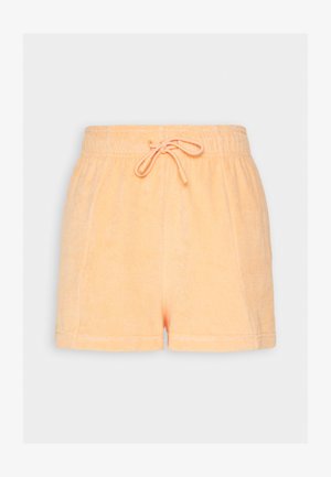 Peachfargede terry shorts med elastisk liv og snøring. Har en myk tekstur og avslappet passform.