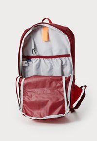 Red backpack with gray lining, featuring a spacious main compartment, inner pockets, and a flat, zippered front pocket. Includes a loop and tag.