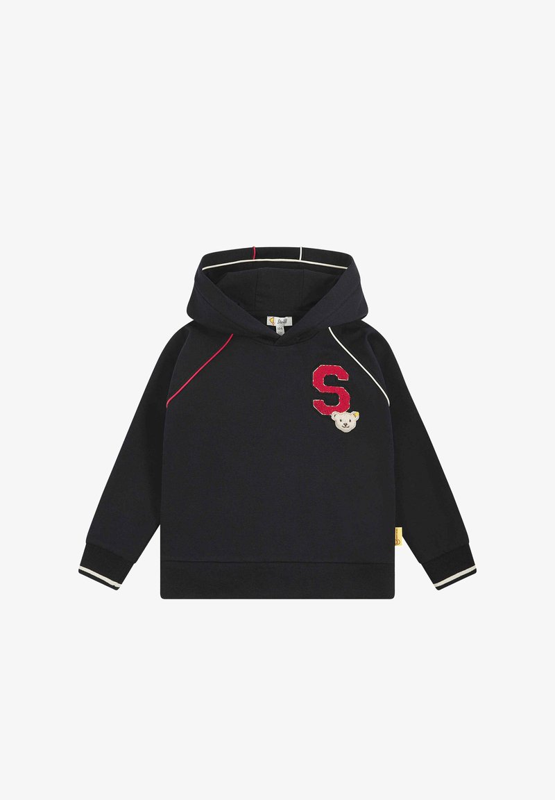 Felpa con cappuccio color navy, dotata di cordino, patch rosso con la "S", emblemma di un orso e dettagli bianchi a contrasto su maniche e orlo. Tessuto morbido in misto cotone.