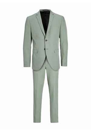 Lys grøn dragt lavet af glat stof, der har en to-knaps blazer med klapkraver, en enkelt brystlomme og slim-fit bukser.