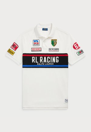 White polo shirt with short sleeves, featuring a black and red horizontal stripe. Embellished with multiple colorful patches and logos.
