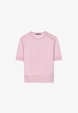 Light pink short-sleeve sweater made of soft knit fabric. Features ribbed hem and three decorative gold buttons on the left shoulder.
