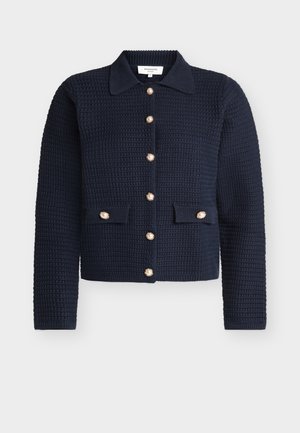 Cardigan texturat pentru femei, de culoare albastru închis, cu mâneci lungi, guler, nasturi de tip perlă pe față și două capse de buzunare cu nasturi asortați.