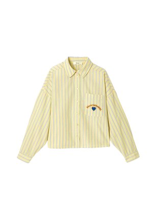 Chemise jaune boutonnée avec des rayures verticales bleues, manches longues, poche poitrine et texte "HEARTBREAKER" avec broderie cœur bleue.