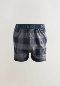 Granatowo-szare bokserki w kratę z guzikiem na rozporku, elastycznym pasem z logo „NEXT” oraz miękką bawełnianą mieszanką tkaniny.