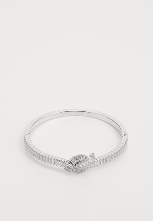 Silver bangle bracelet with a twist design, featuring alternating rectangular and round stones, and a sleek polished finish.